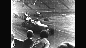 Young spectators watch midget car racing at Hastings Park, Vancouver.